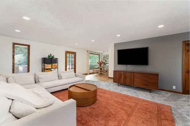 a dining room with furniture and wooden floor