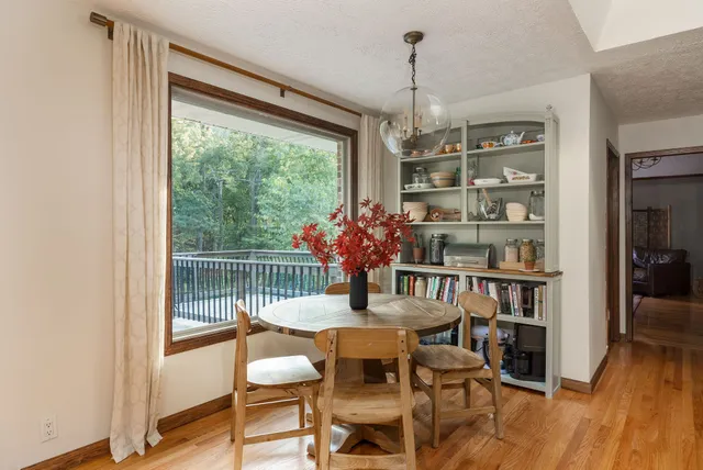 a kitchen with kitchen island a sink appliances and cabinets