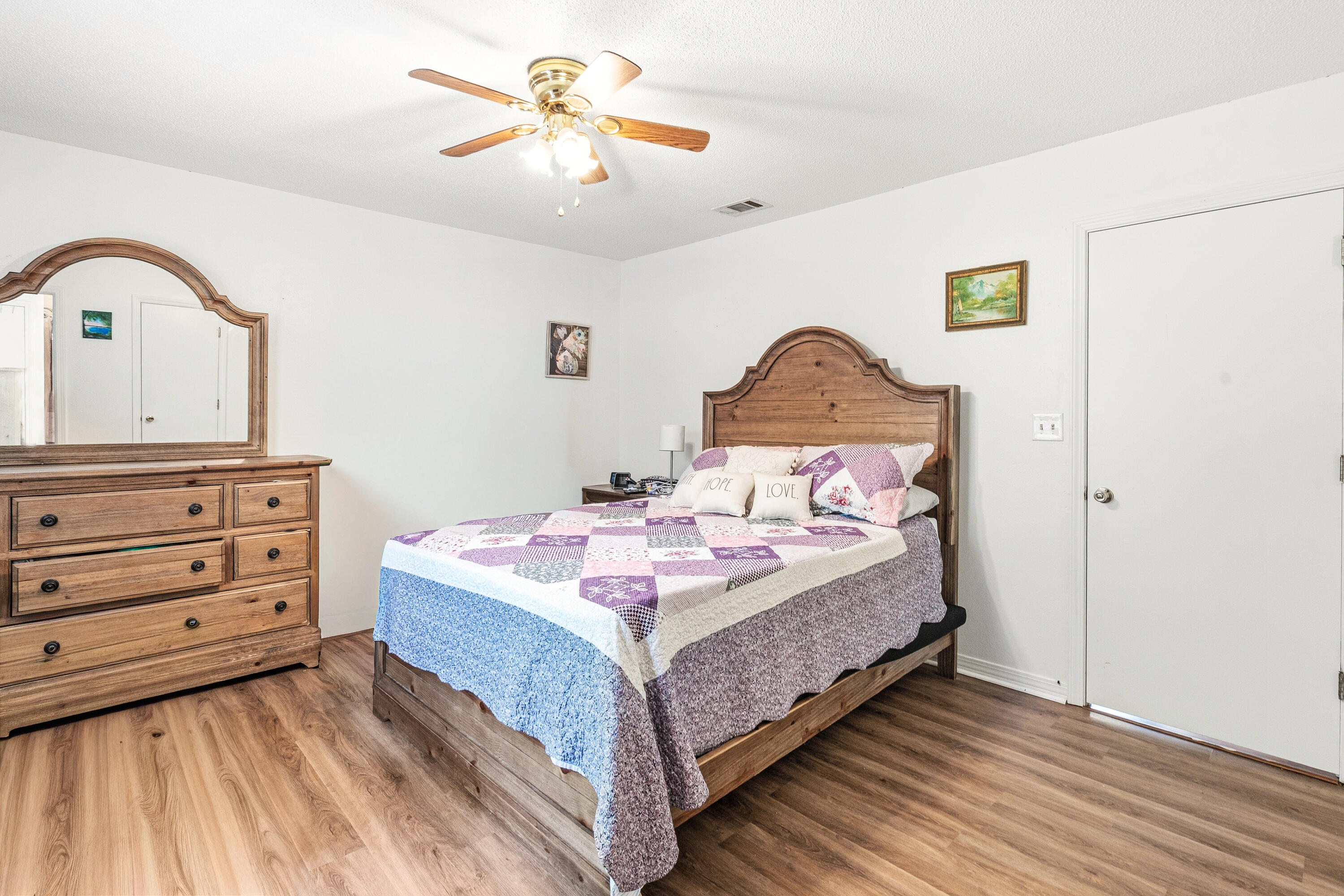 2880 Aplin Road Crestview, FL 32539 - Photo 26 of 33 a spacious bedroom with a bed and a dresser