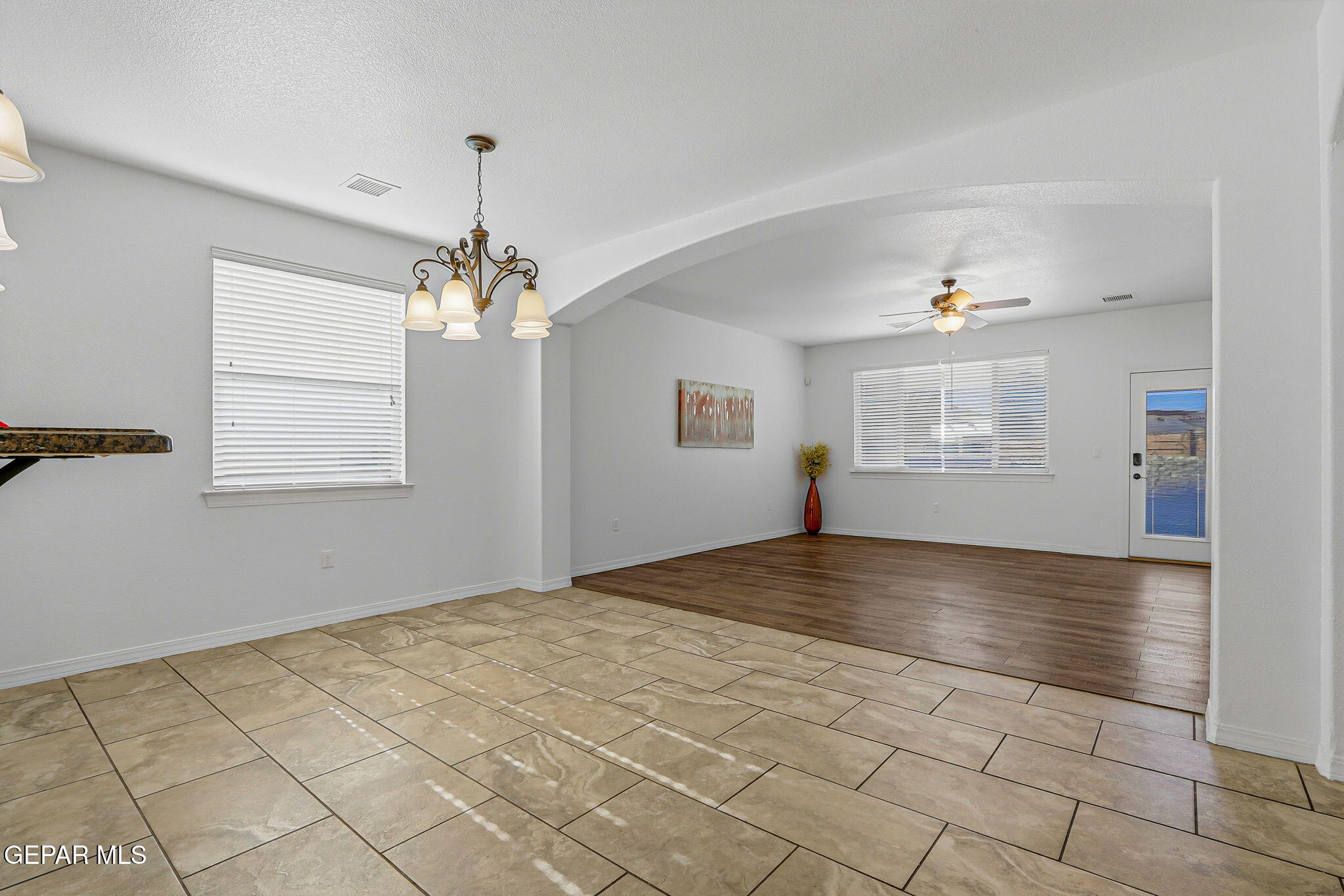 520 Gomez Road El Paso, TX 79932 - Photo 19 of 72 a view of empty room with wooden floor and fan