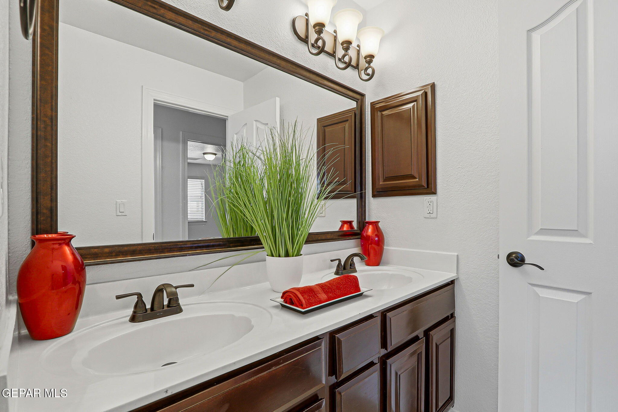 520 Gomez Road El Paso, TX 79932 - Photo 32 of 72 a bathroom with a sink and a mirror