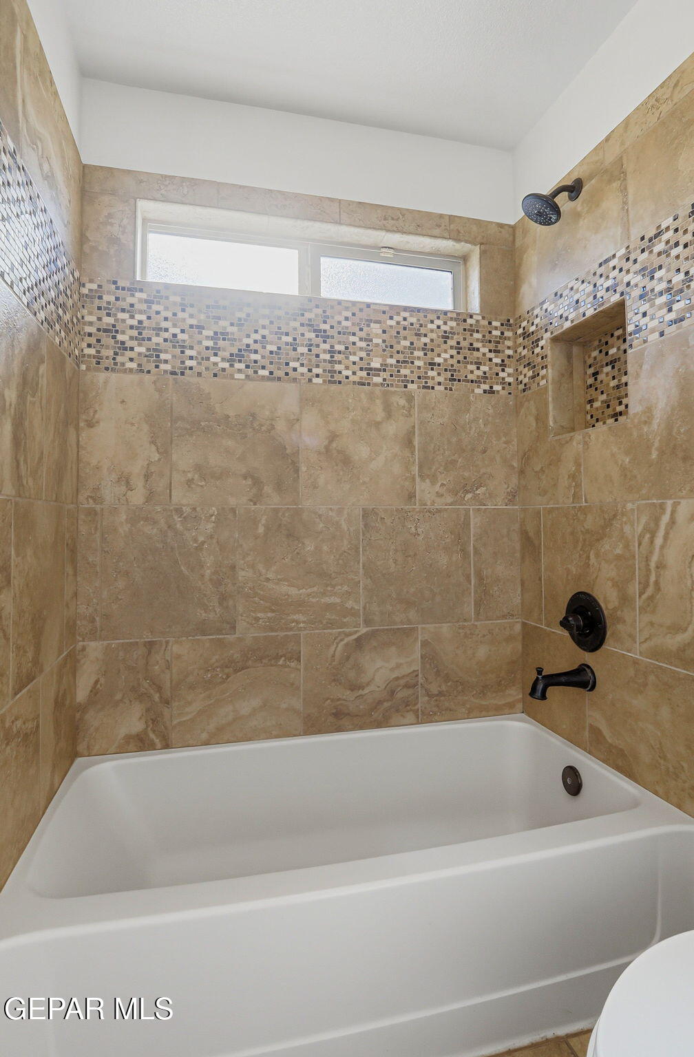 520 Gomez Road El Paso, TX 79932 - Photo 33 of 72 a bathroom with a shower and a bath tub