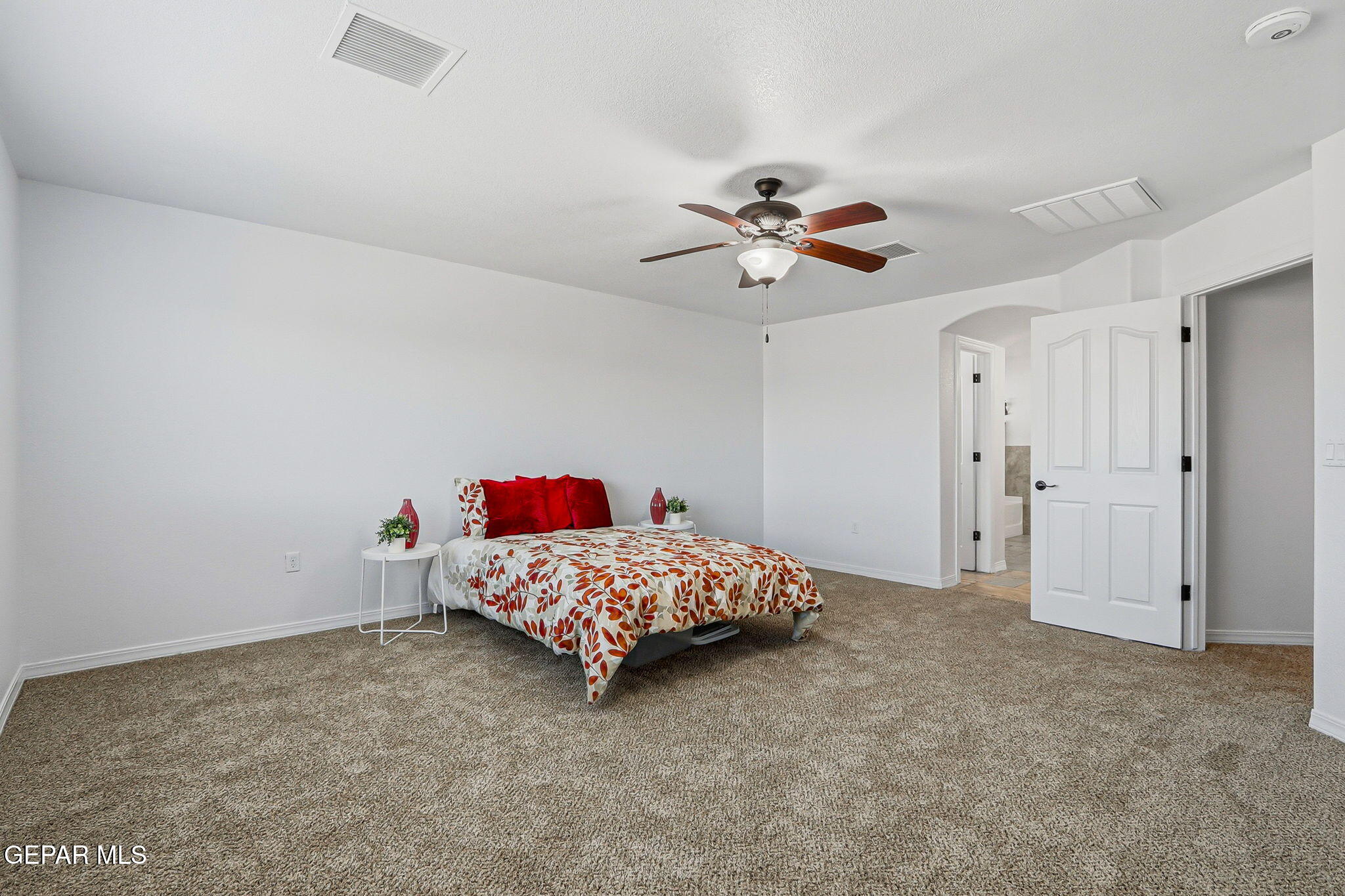 520 Gomez Road El Paso, TX 79932 - Photo 49 of 72 a bedroom with a bed and a chandelier