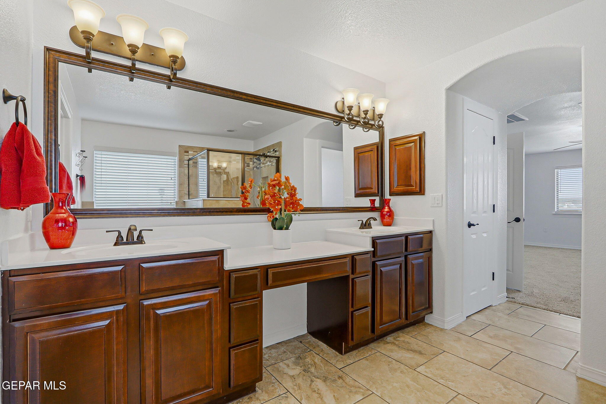 520 Gomez Road El Paso, TX 79932 - Photo 52 of 72 a bathroom with a sink and a mirror