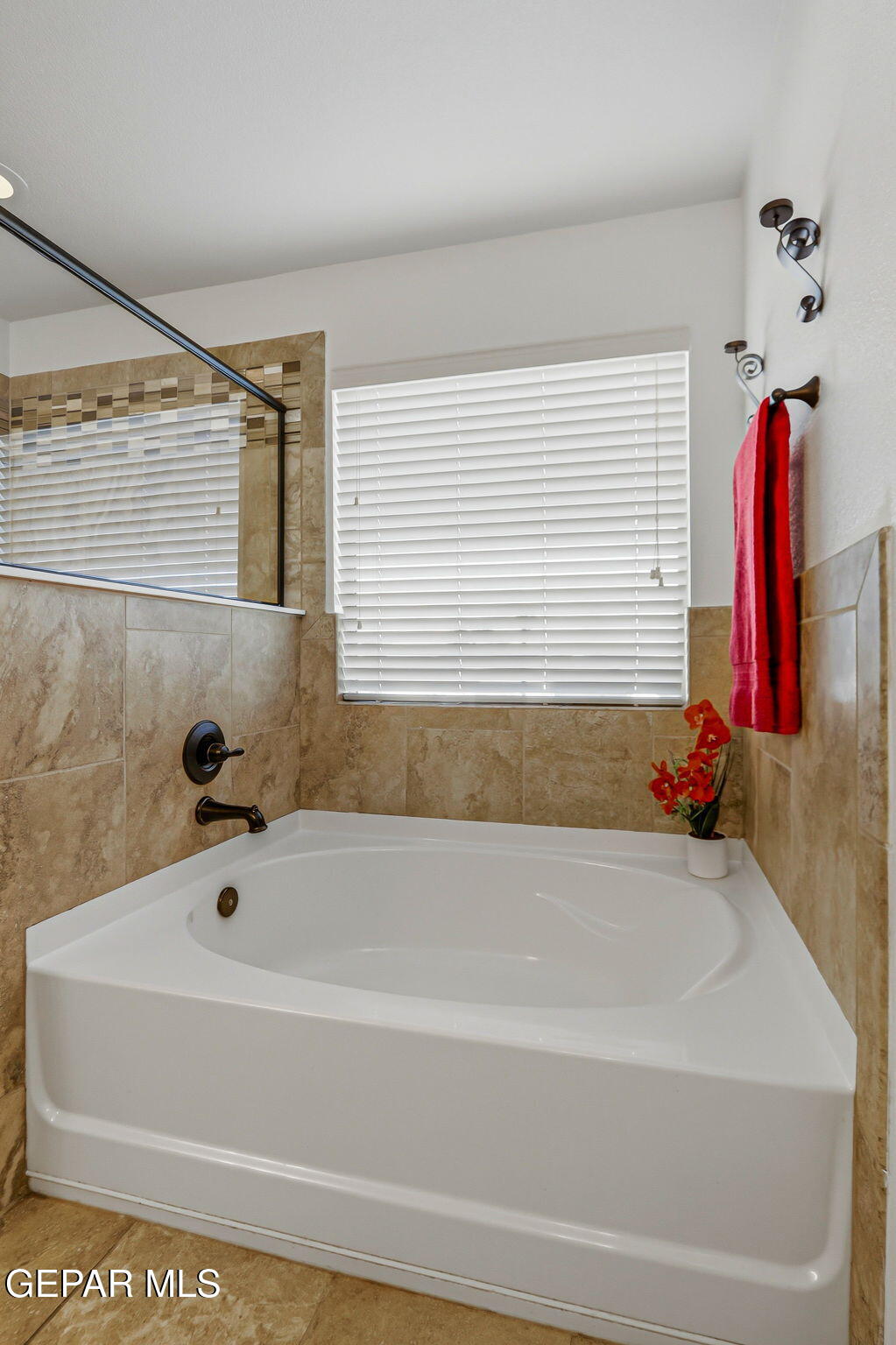 520 Gomez Road El Paso, TX 79932 - Photo 53 of 72 a bathroom with a bathtub and a shower