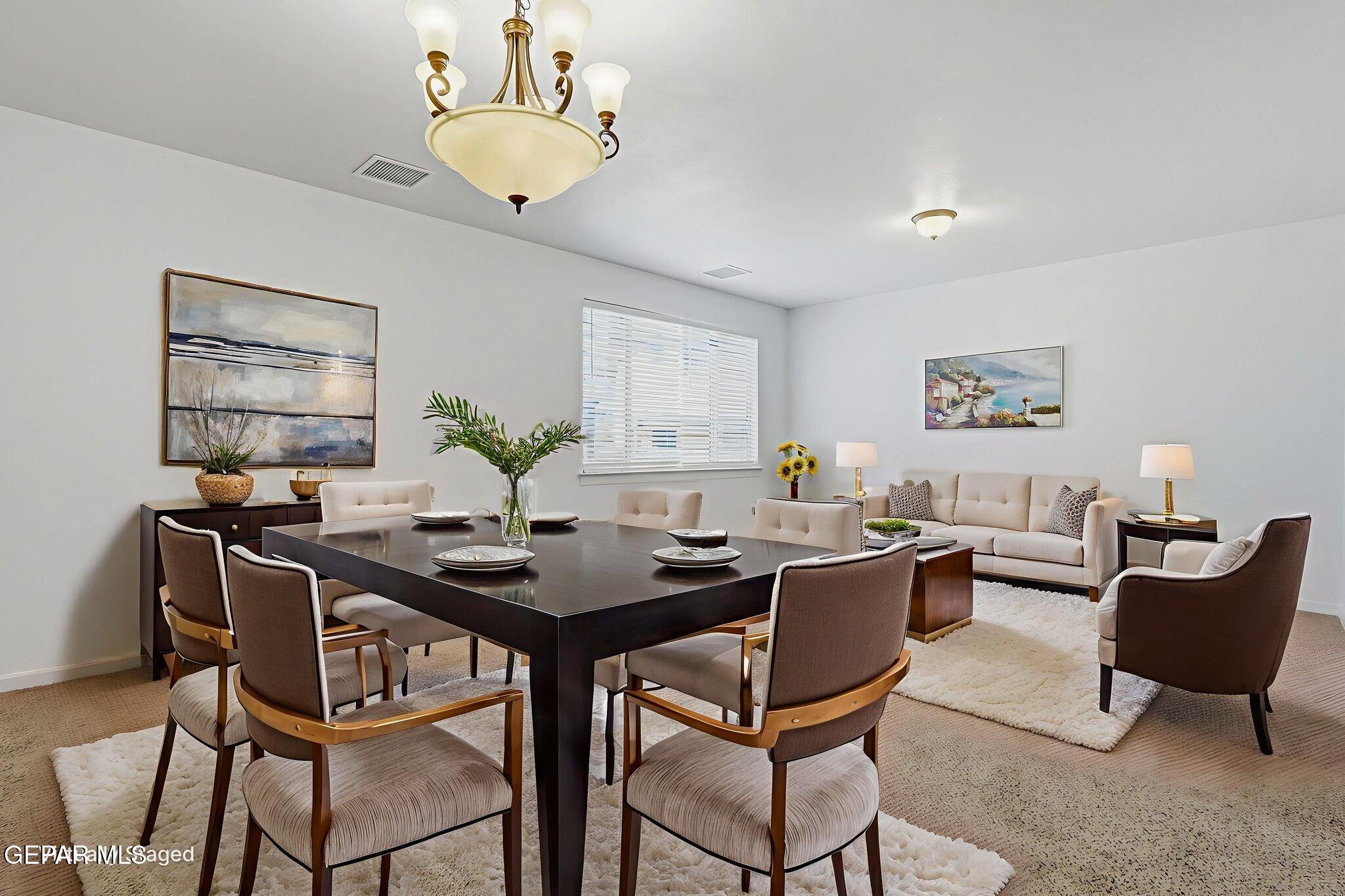 520 Gomez Road El Paso, TX 79932 - Photo 7 of 72 a view of a dining room with furniture and chandelier