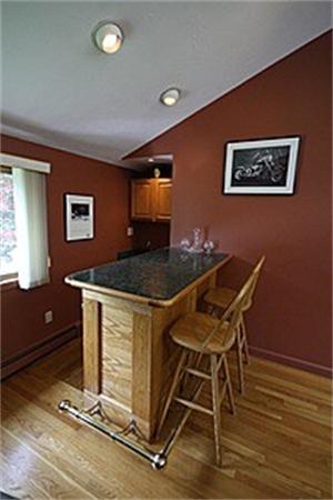 43 Little Farms Road Framingham, MA 01701 - Photo 11 of 20 a workspace with wooden floor and windows