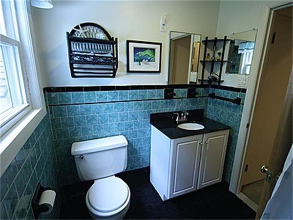 43 Little Farms Road Framingham, MA 01701 - Photo 16 of 20 a bathroom with a toilet a sink and mirror