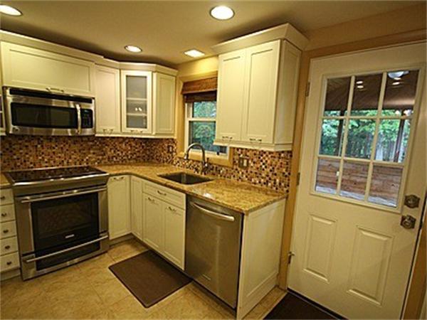 43 Little Farms Road Framingham, MA 01701 - Photo 3 of 20 a kitchen with a sink and a stove top oven