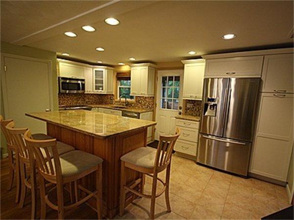 43 Little Farms Road Framingham, MA 01701 - Photo 4 of 20 a kitchen with a table and refrigerator