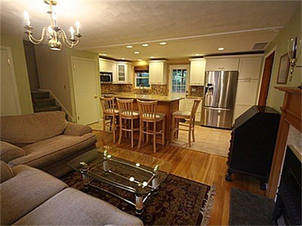 43 Little Farms Road Framingham, MA 01701 - Photo 5 of 20 a living room with lots of furniture and a chandelier