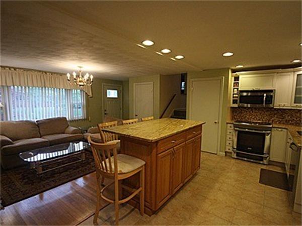 43 Little Farms Road Framingham, MA 01701 - Photo 6 of 20 a kitchen with a stove a sink and a refrigerator