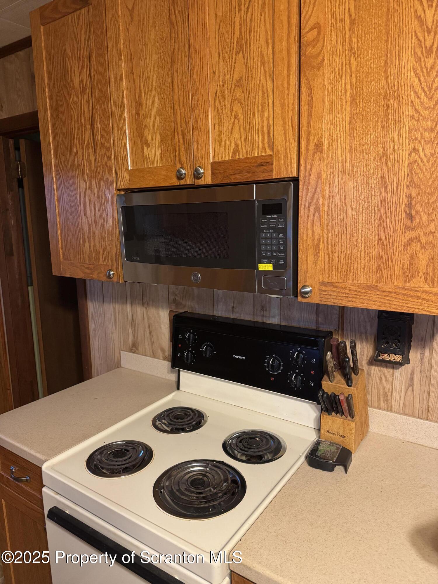 18285 Pa-92 Jackson, PA 18825 - Photo 21 of 49 a kitchen with a stove and a microwave