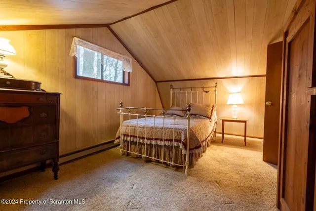 a backyard of a house with barbeque oven table and chairs
