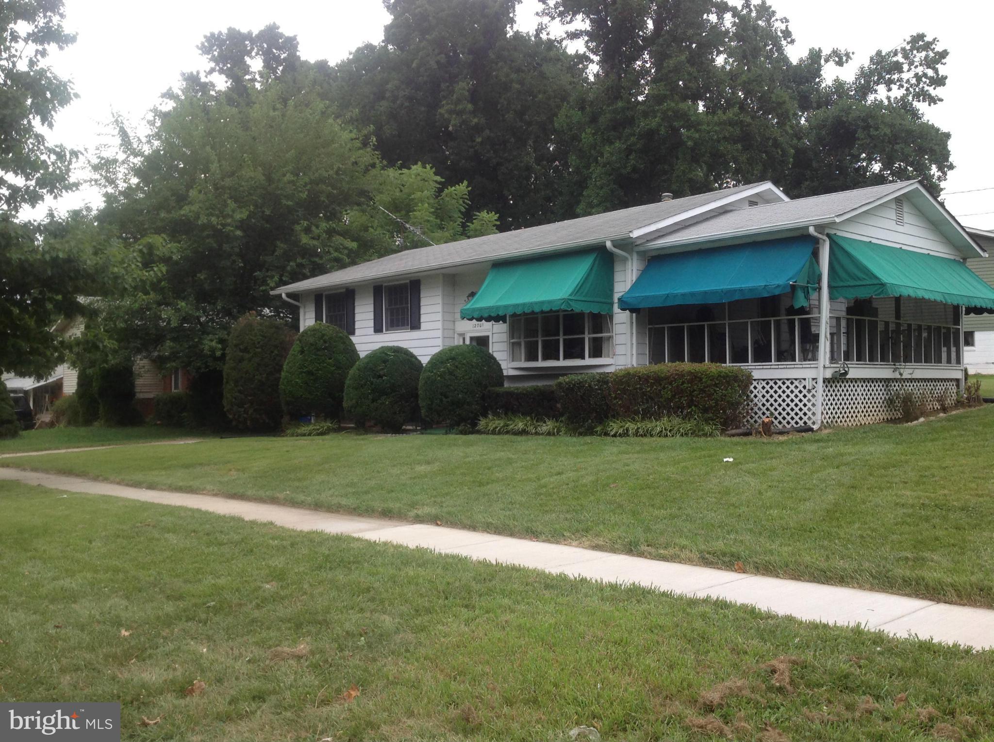 12701 Barbara Road Silver Spring, MD 20906 - Photo 2 of 21 a view of a house with a big yard and potted plants and large trees