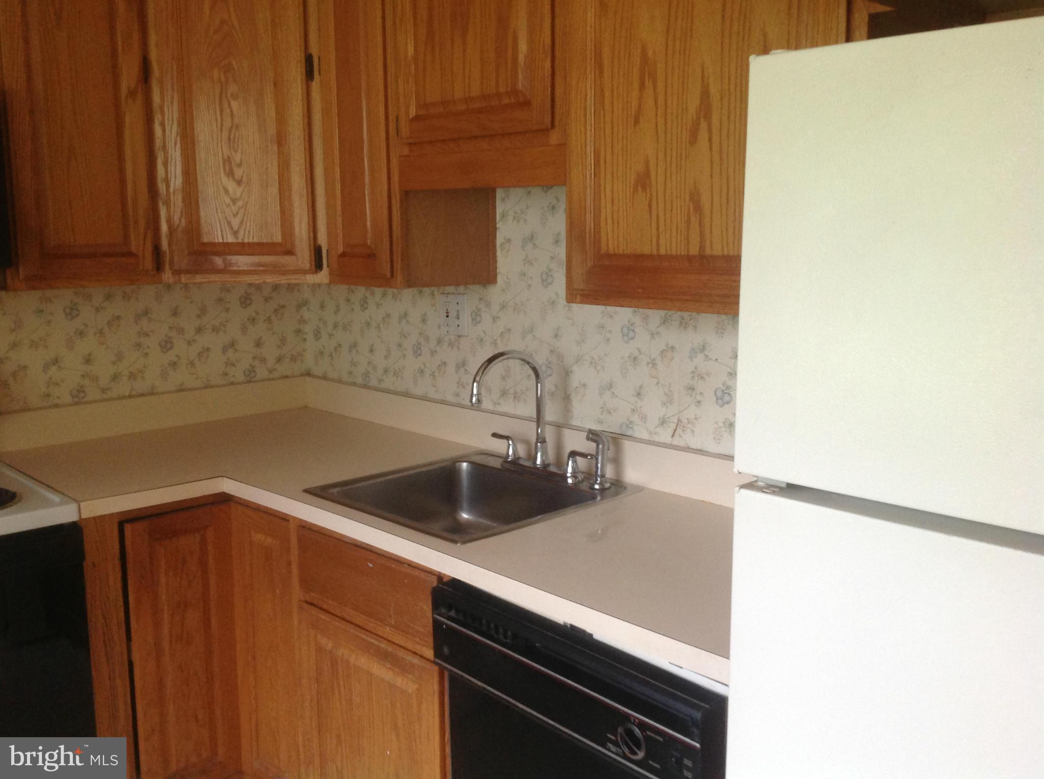 12701 Barbara Road Silver Spring, MD 20906 - Photo 12 of 21 a kitchen with a sink and cabinets