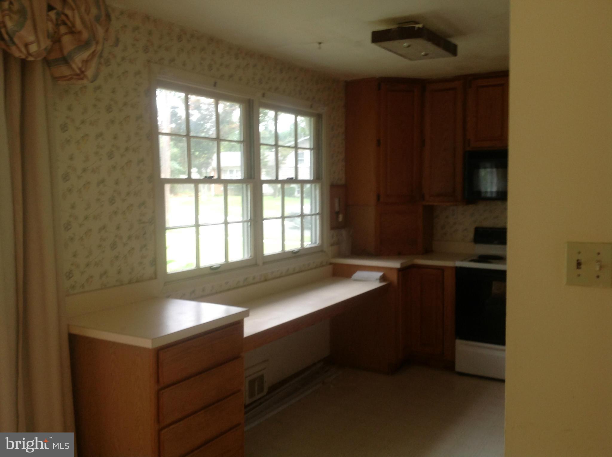 12701 Barbara Road Silver Spring, MD 20906 - Photo 13 of 21 a room with a bed and a window