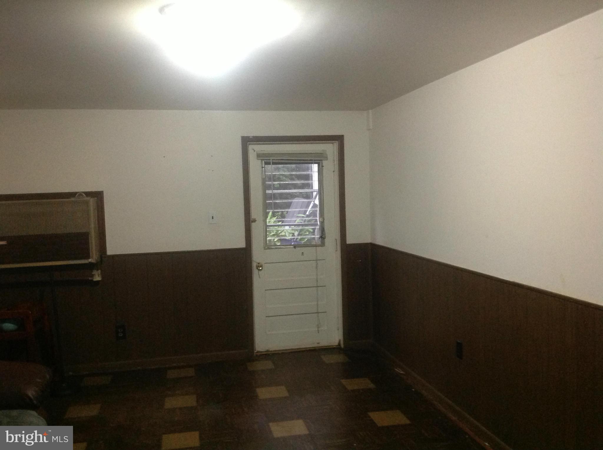 12701 Barbara Road Silver Spring, MD 20906 - Photo 18 of 21 a view of an empty room and window