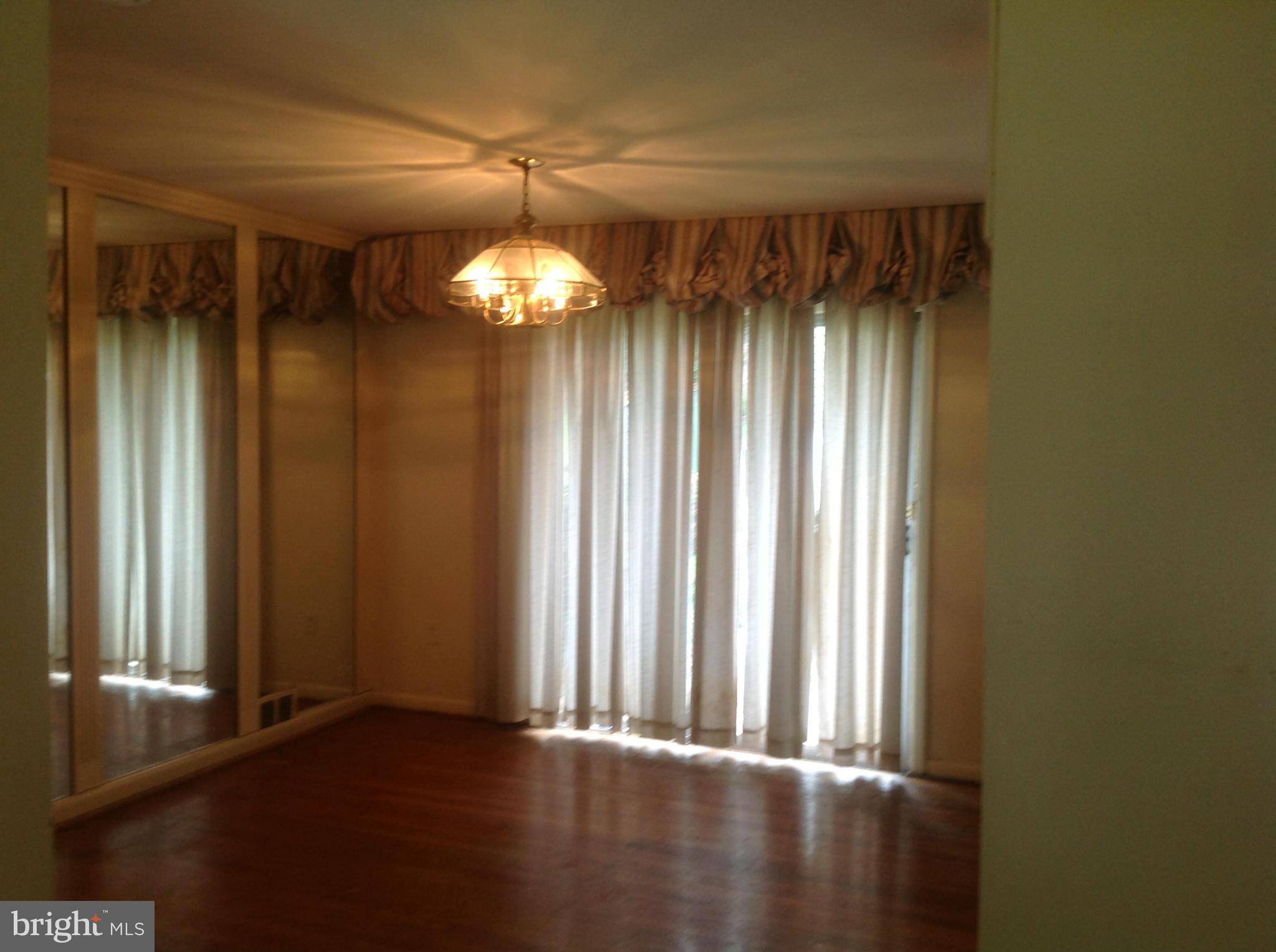 12701 Barbara Road Silver Spring, MD 20906 - Photo 8 of 21 a view of a room with a window and chandelier