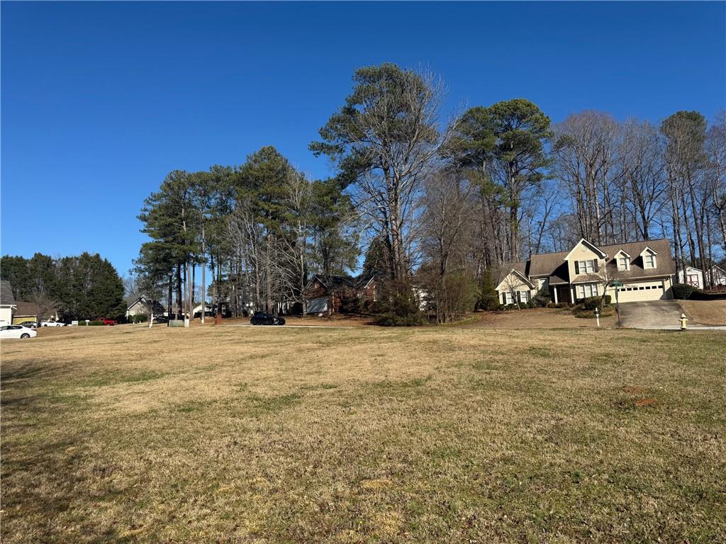 245 Camerons Way Covington, GA 30016 - Photo 5 of 10 a view of a street with houses