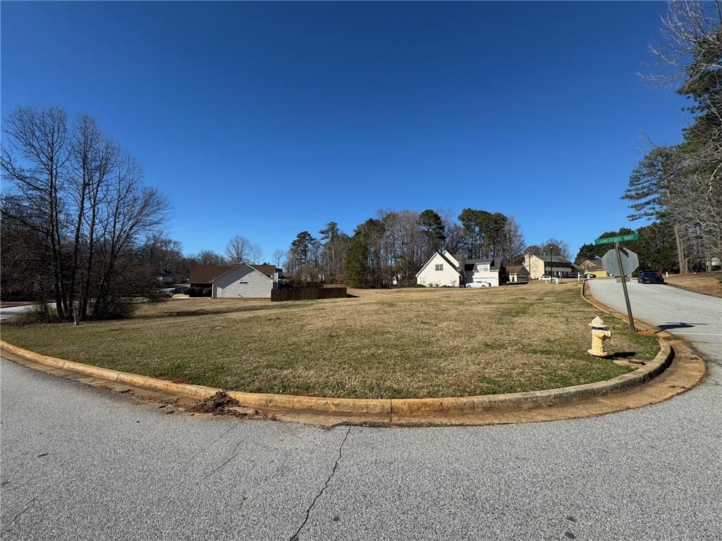 245 Camerons Way Covington, GA 30016 - Photo 8 of 10 a view of a tiny house with a yard