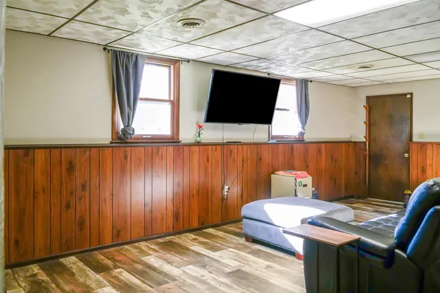 a bedroom with a bed and a television