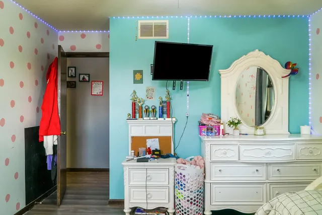 a bedroom with a bed and a window