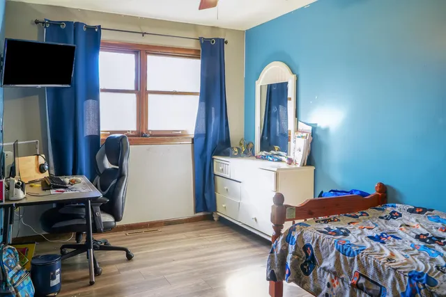 a bathroom with a sink a toilet and shower curtain