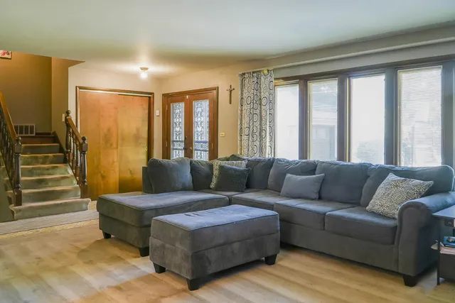 a living room with furniture and a large window