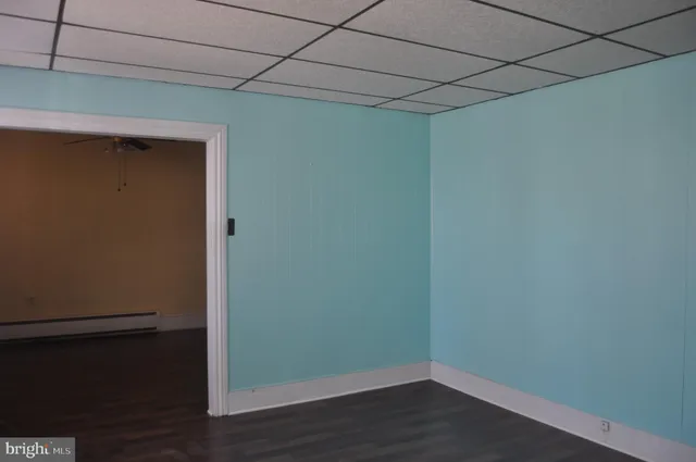 a view of a small space with wooden floor