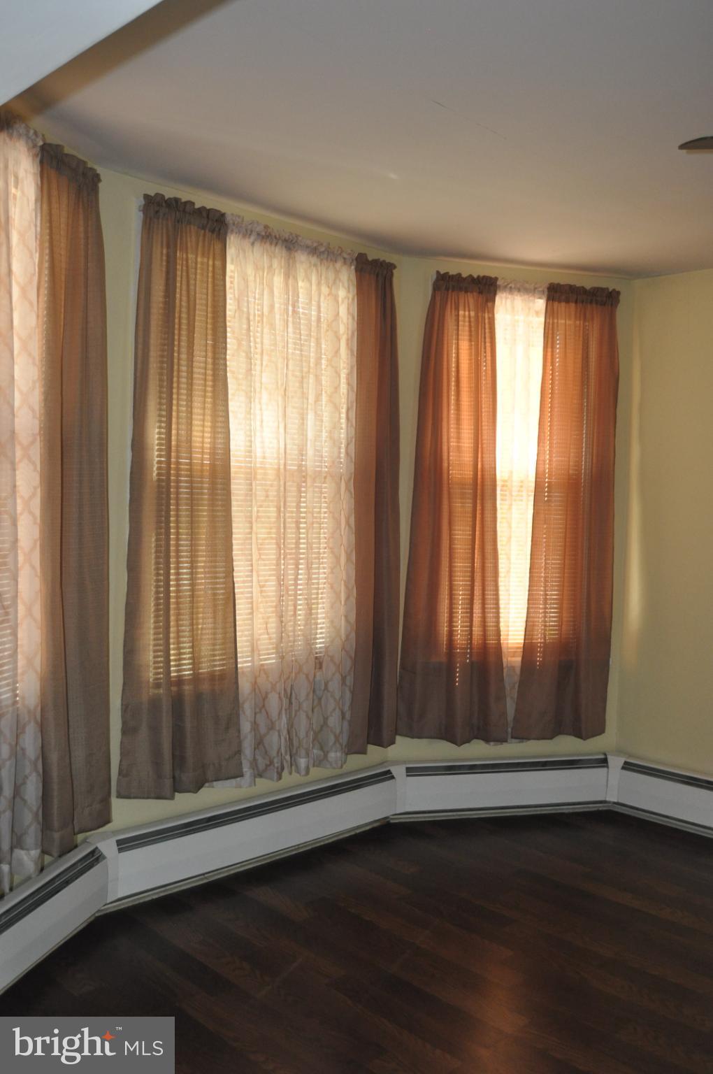 540 South 2nd Street Lykens, PA 17048 - Photo 14 of 42 an empty room with wooden floor and door