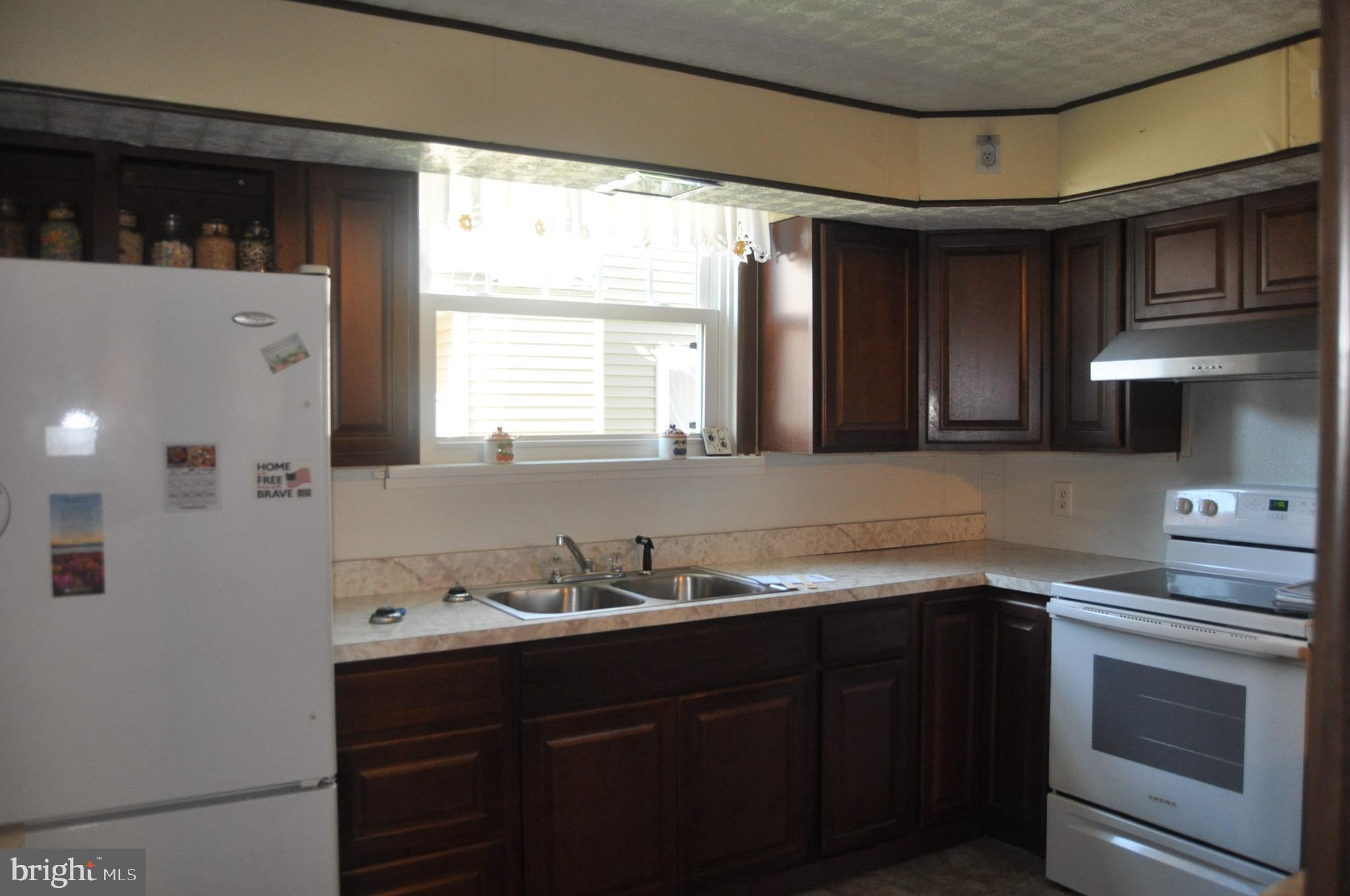 540 South 2nd Street Lykens, PA 17048 - Photo 17 of 42 a kitchen with granite countertop a sink cabinets and stainless steel appliances