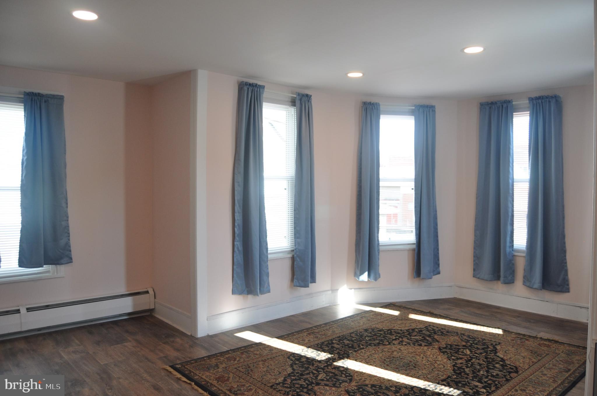 540 South 2nd Street Lykens, PA 17048 - Photo 22 of 42 a view of an empty room with wooden floor and a window