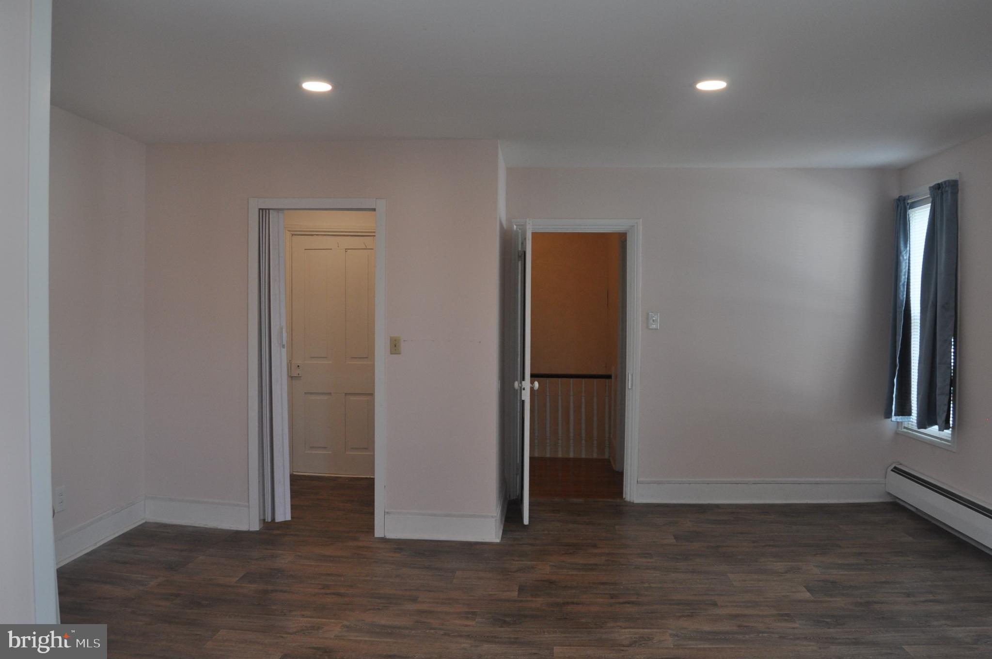 540 South 2nd Street Lykens, PA 17048 - Photo 24 of 42 an empty room with wooden floor and entrance