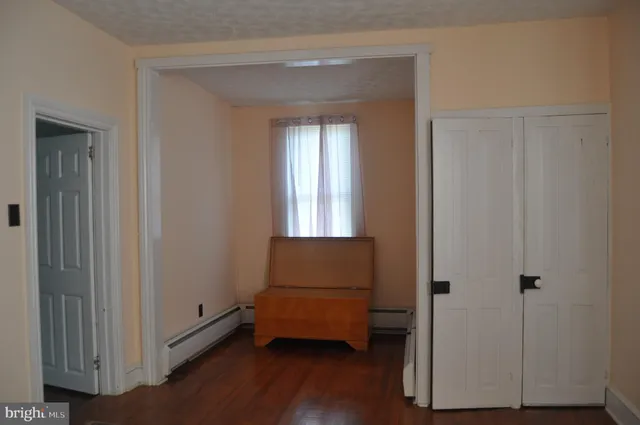 a room that has a window and a wooden floor