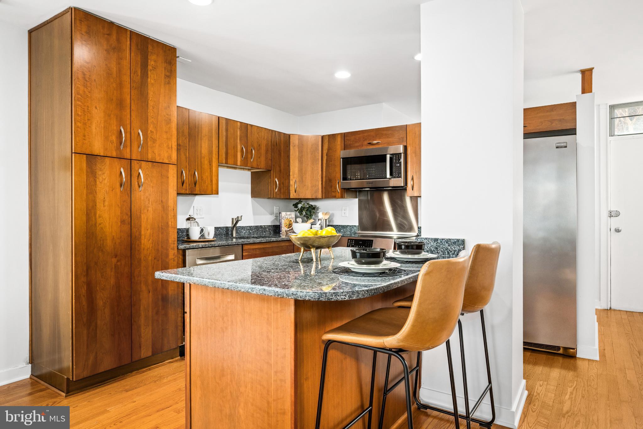 345 O Street Southwest Washington, DC 20024 - Photo 13 of 64 a kitchen with stainless steel appliances granite countertop a sink refrigerator and cabinets