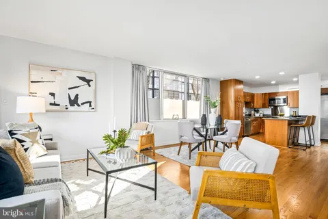 a kitchen with stainless steel appliances granite countertop a sink refrigerator and cabinets