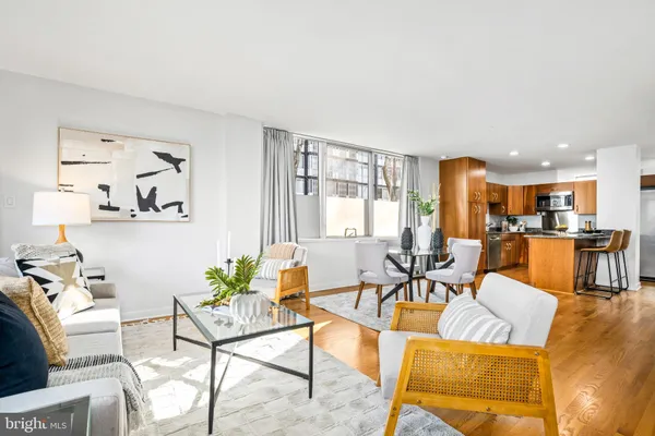 a kitchen with stainless steel appliances granite countertop a sink refrigerator and cabinets