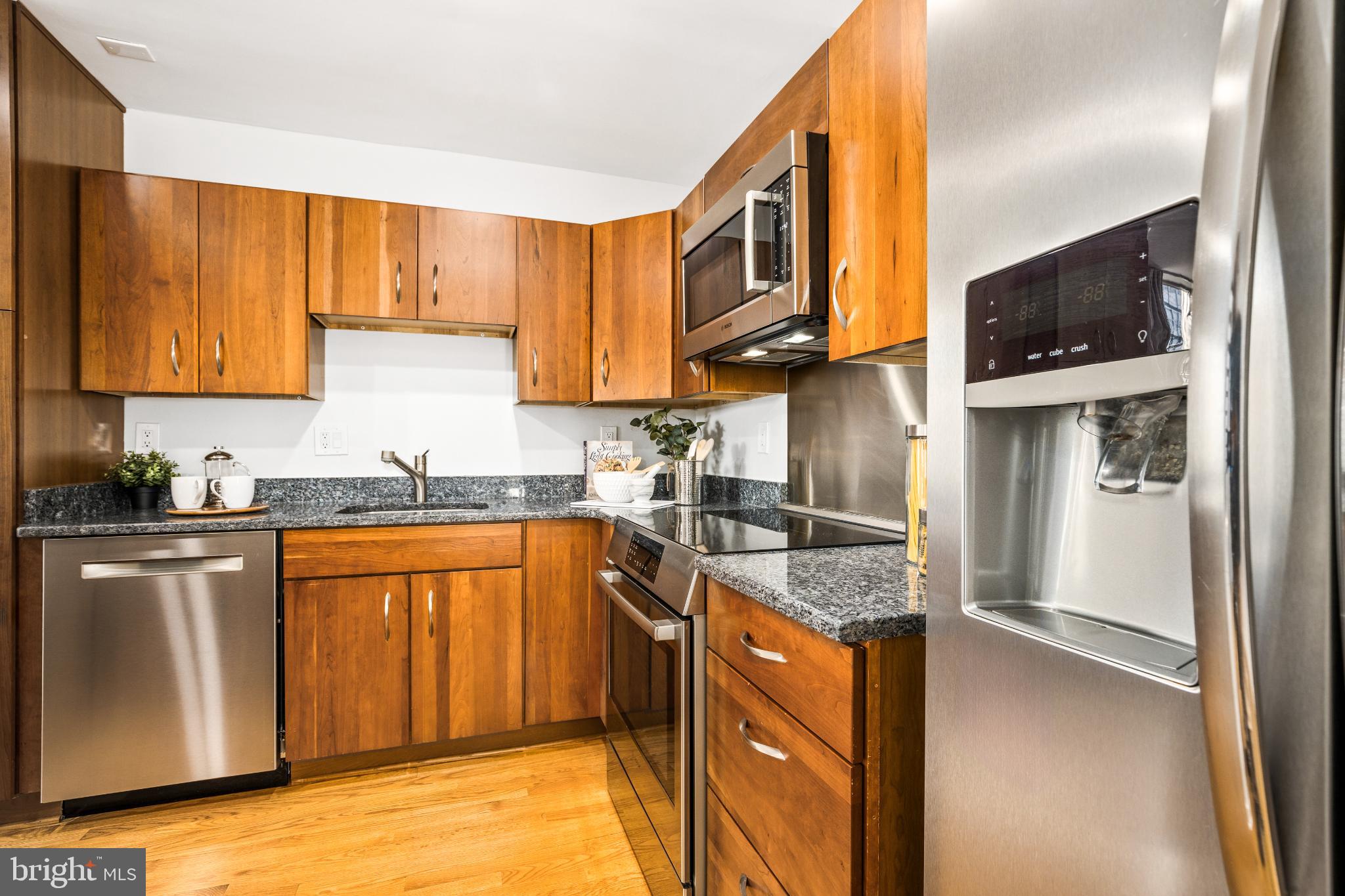 345 O Street Southwest Washington, DC 20024 - Photo 2 of 64 a kitchen with stainless steel appliances granite countertop a refrigerator a stove top oven a sink and dishwasher