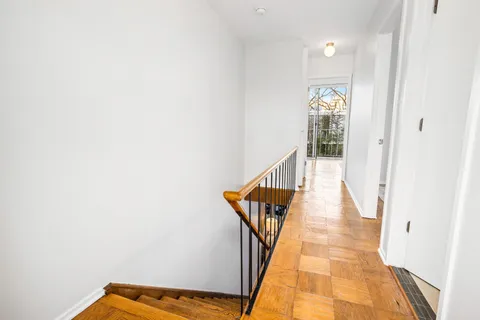 a workspace room with furniture and wooden floor