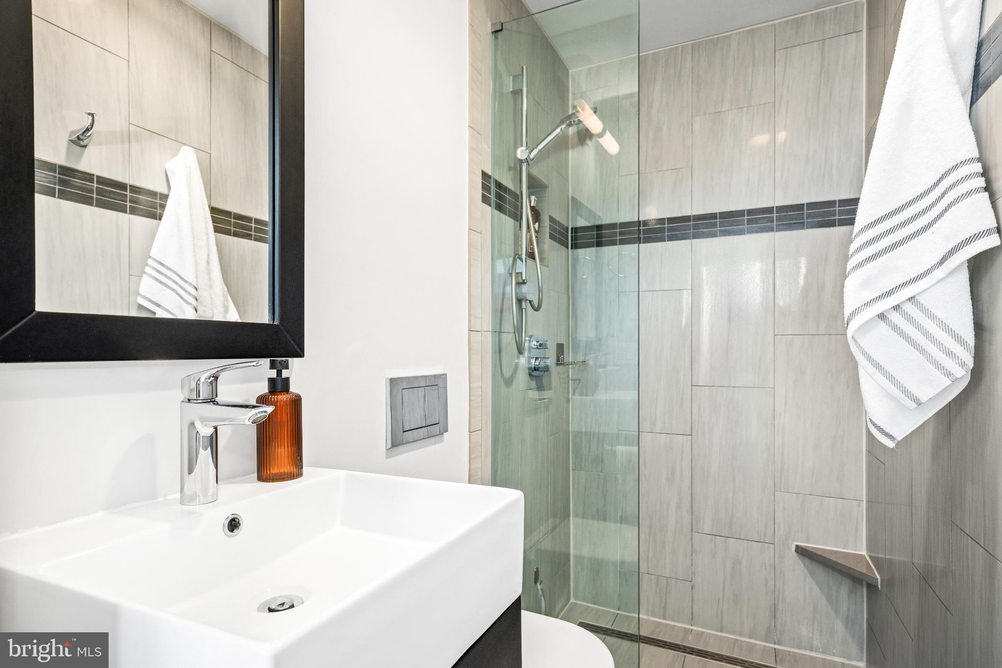 345 O Street Southwest Washington, DC 20024 - Photo 23 of 64 a bathroom with a sink and mirror