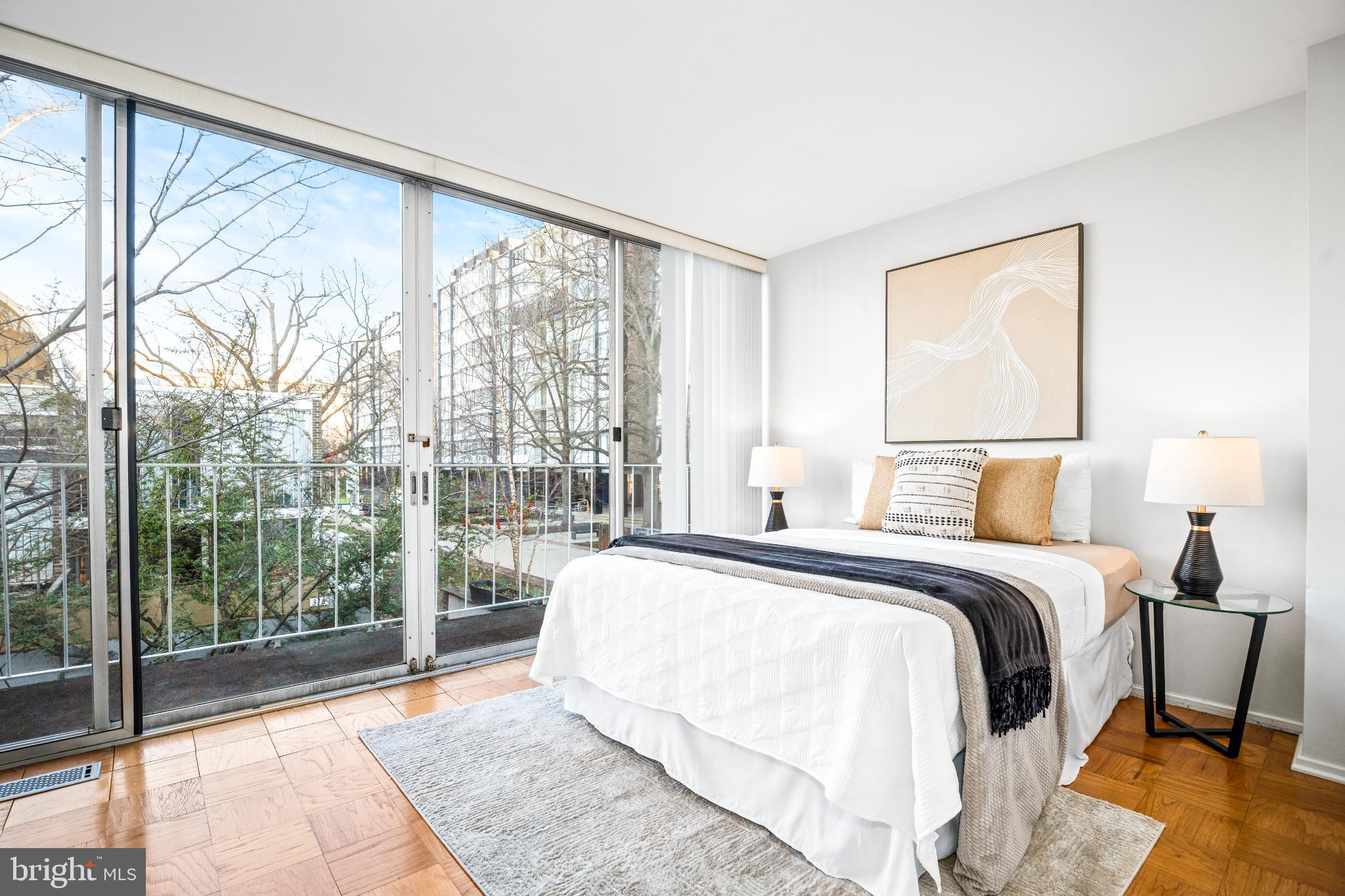 345 O Street Southwest Washington, DC 20024 - Photo 24 of 64 a spacious bedroom with a large bed and a large window