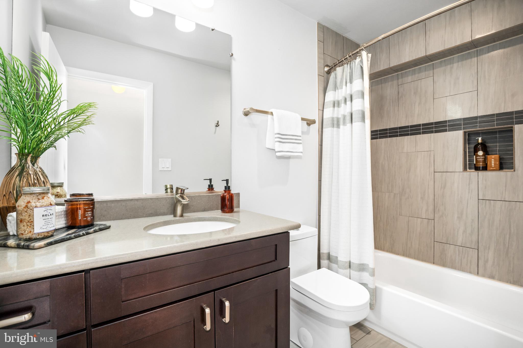 345 O Street Southwest Washington, DC 20024 - Photo 29 of 64 a bathroom with a sink a toilet and shower