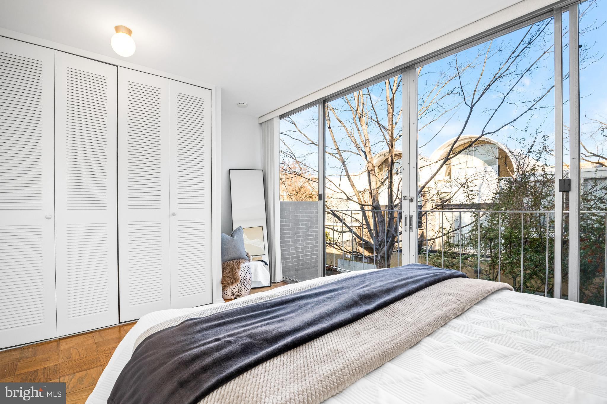 345 O Street Southwest Washington, DC 20024 - Photo 33 of 50 Bright bedroom with expansive glass views.