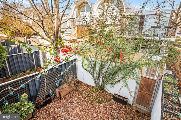 a backyard of a house with large trees