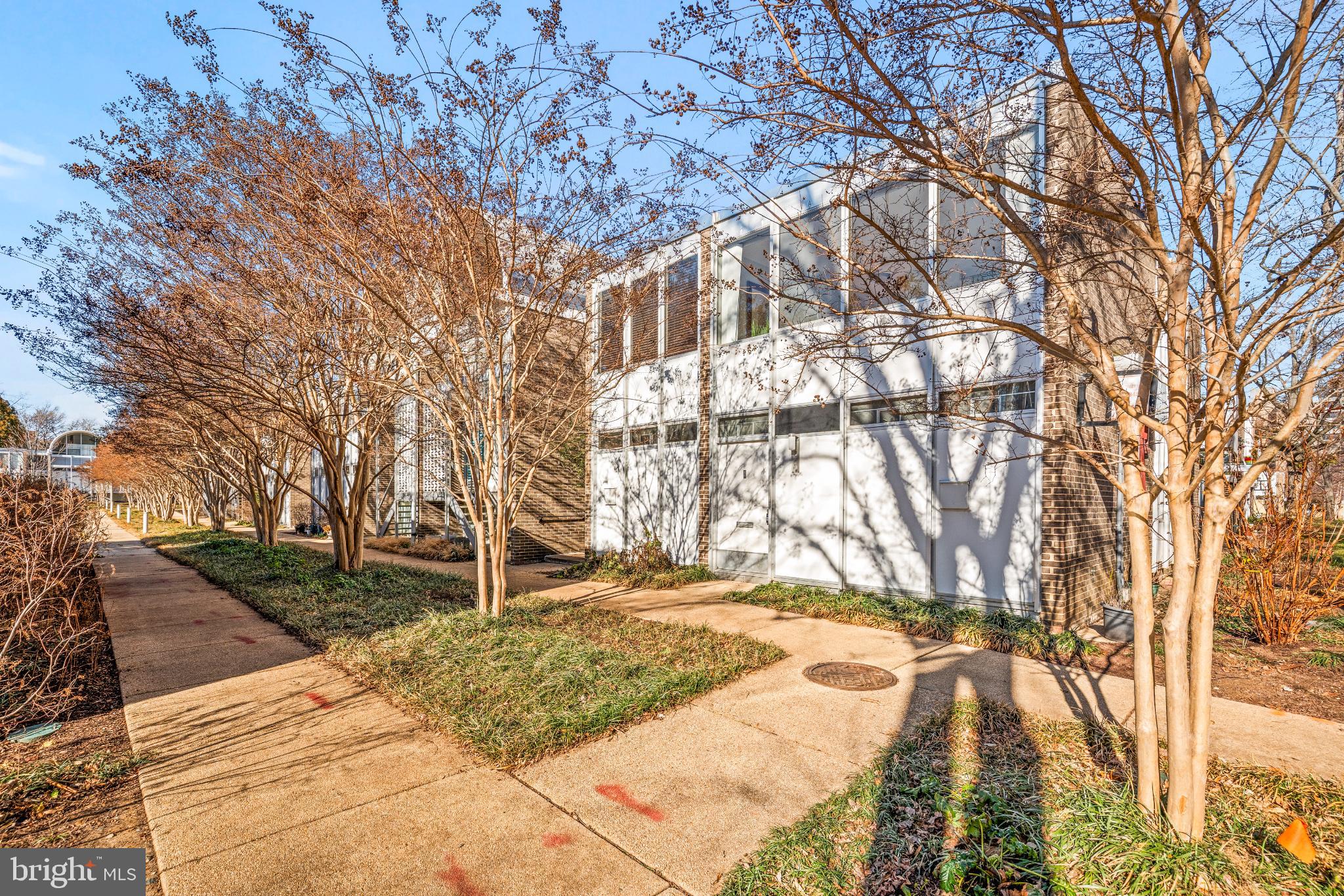345 O Street Southwest Washington, DC 20024 - Photo 8 of 50 Modern architecture framed by seasonal trees.