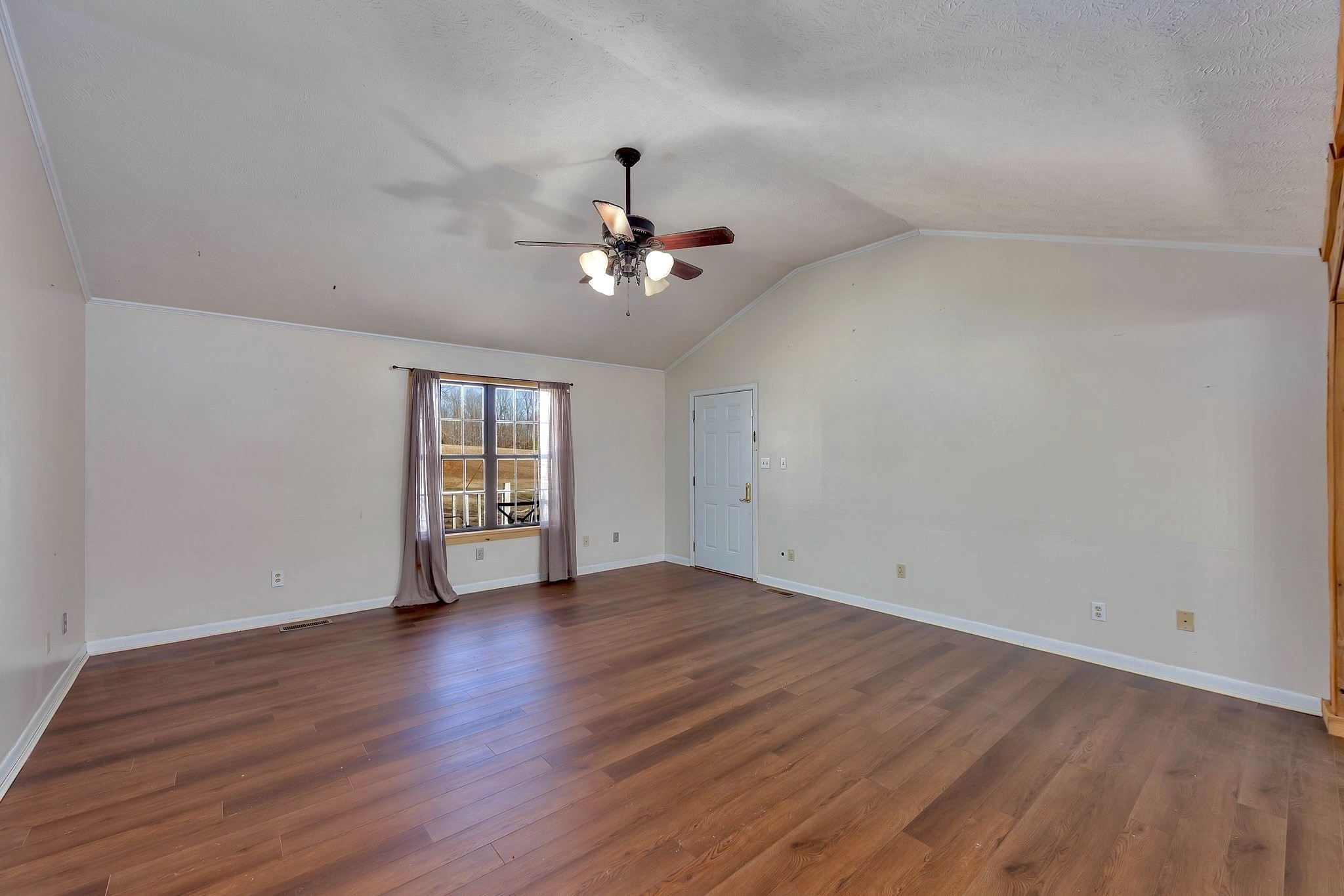 6675 Highway 100 Reagan, TN 38368 - Photo 11 of 32 a view of an empty room with window and wooden floor