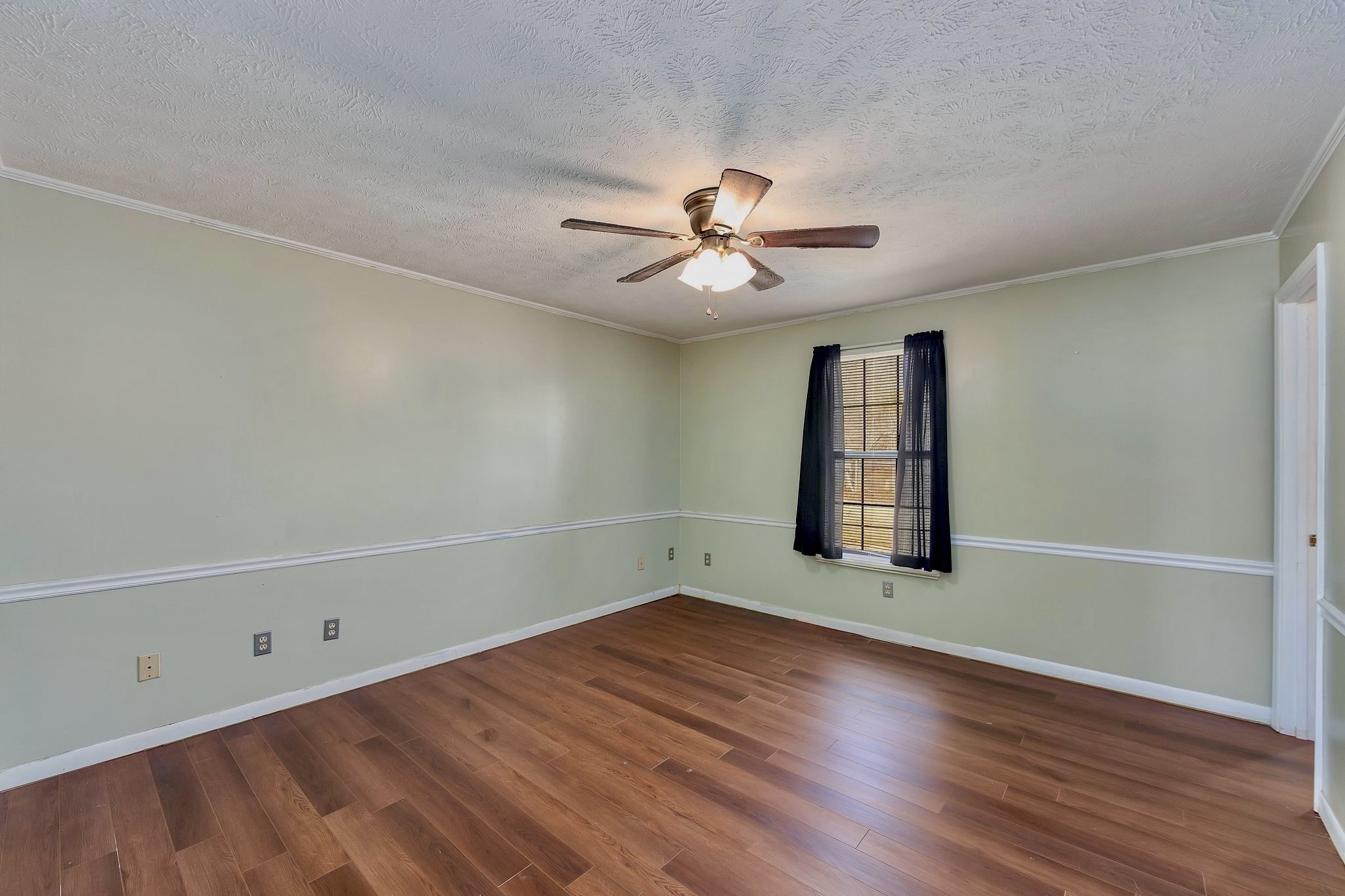 6675 Highway 100 Reagan, TN 38368 - Photo 12 of 32 an empty room with wooden floor and windows