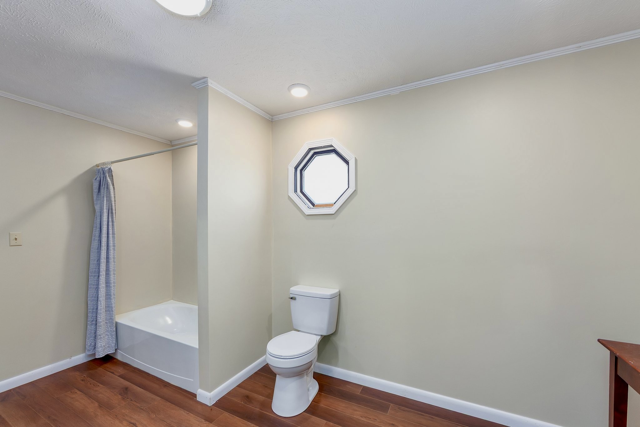 6675 Highway 100 Reagan, TN 38368 - Photo 14 of 32 a bathroom with a toilet a sink and bathtub