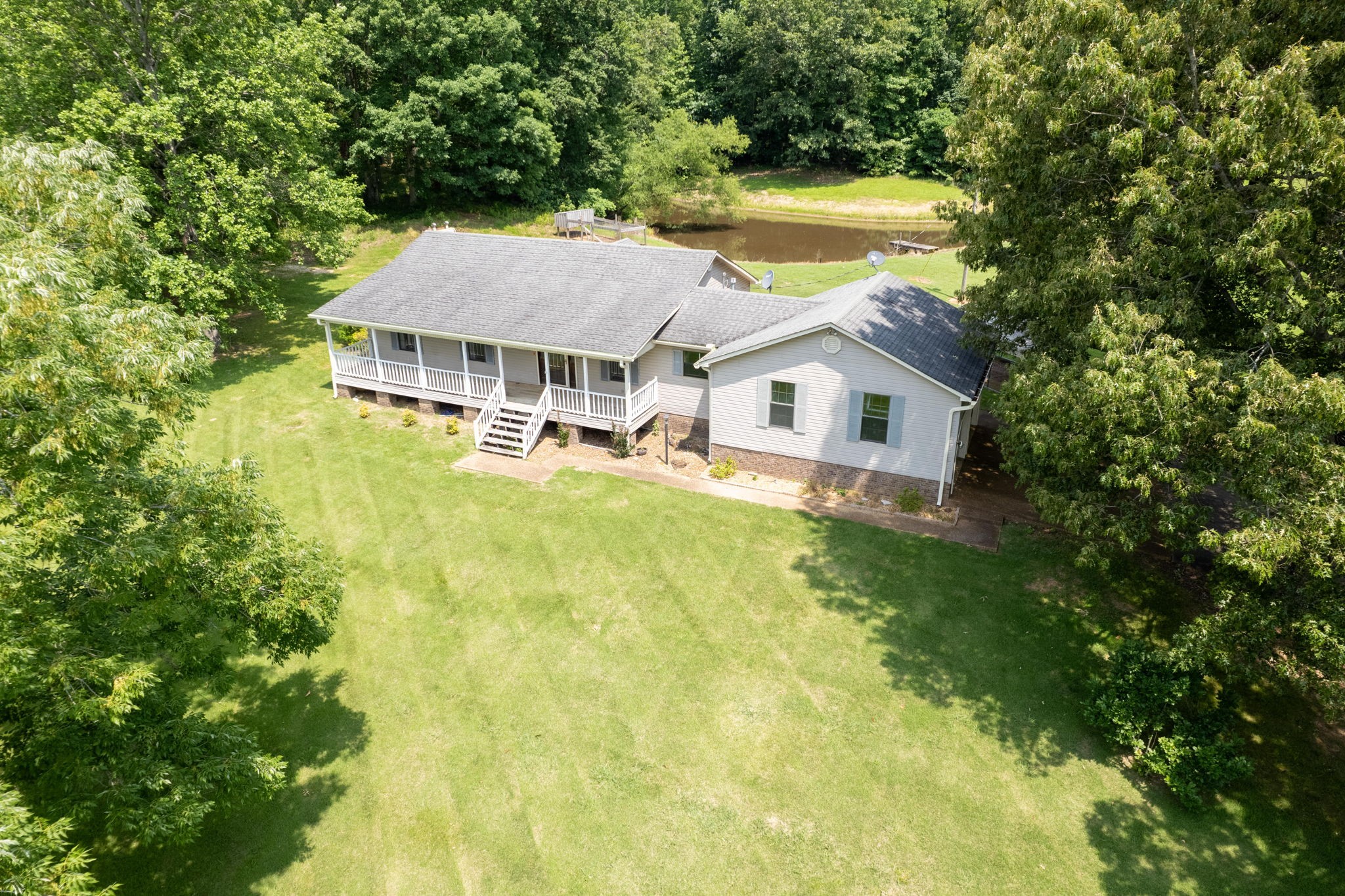 6675 Highway 100 Reagan, TN 38368 - Photo 2 of 32 a view of a house with pool and a yard